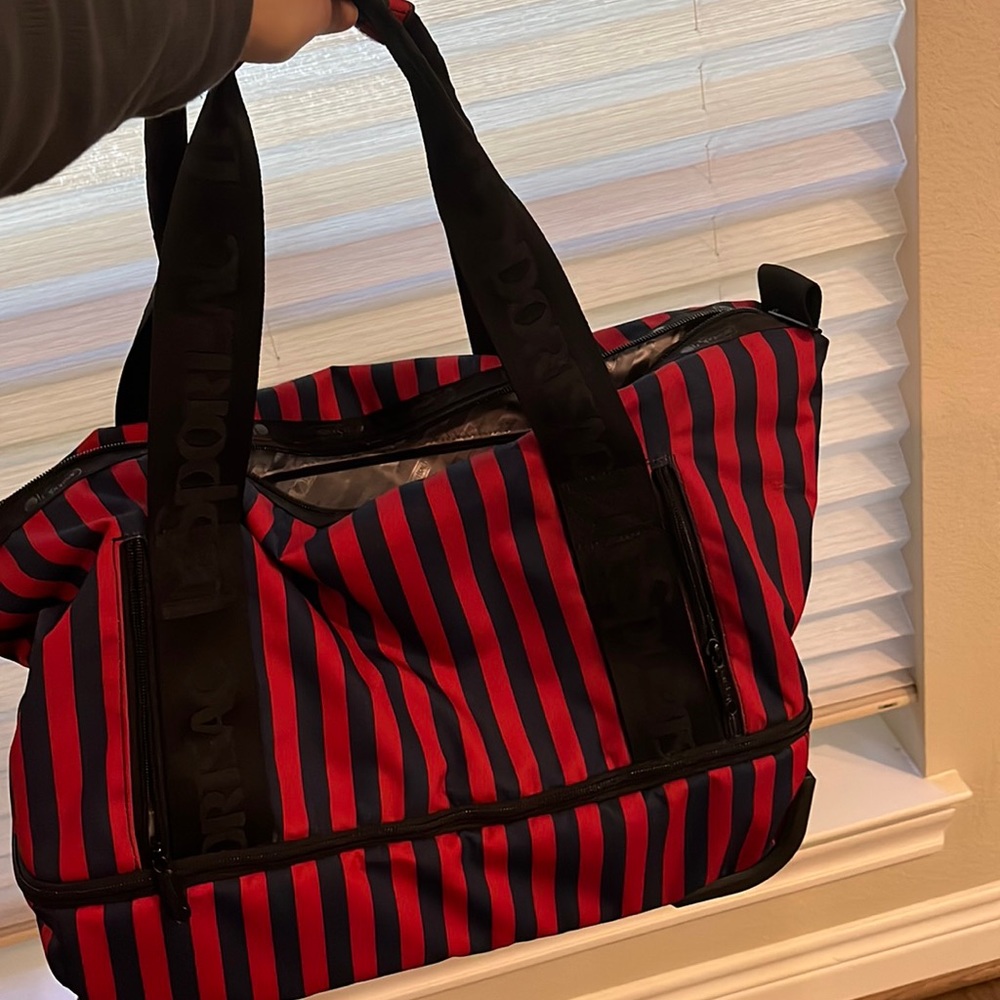 LeSportsac carry on luggage with wheels